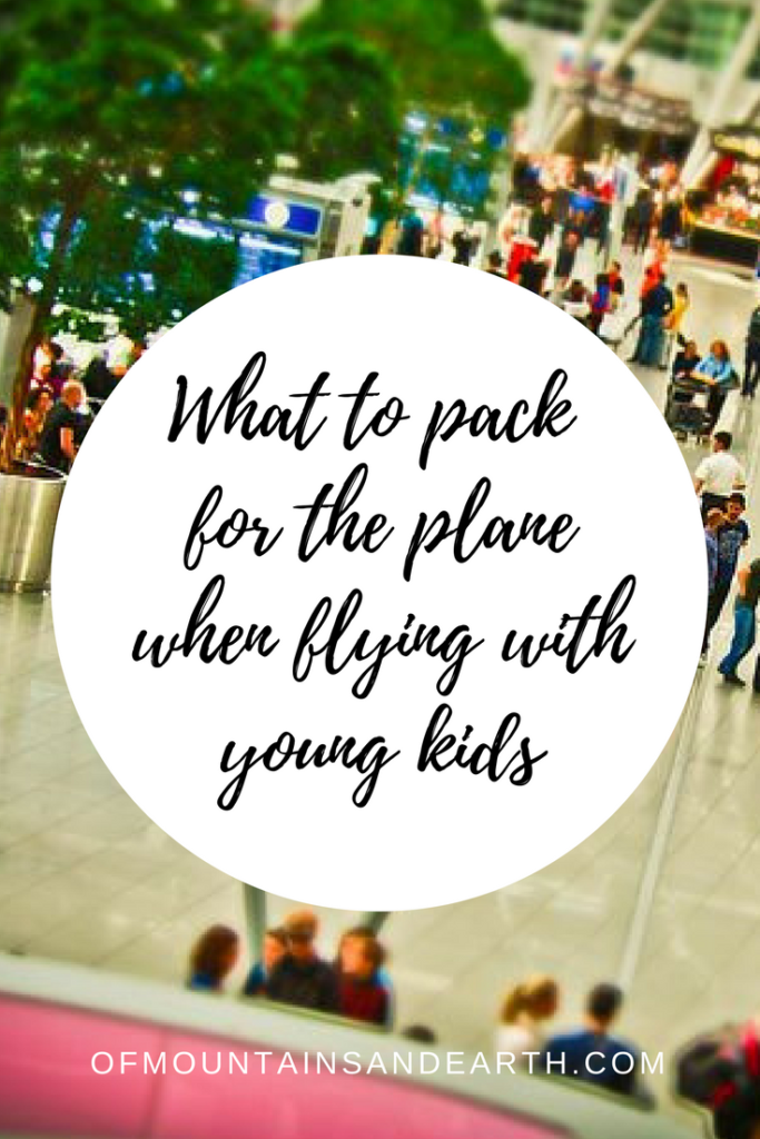What to pack for the airplane when flying with young kids. || ofmountainsandearth.com